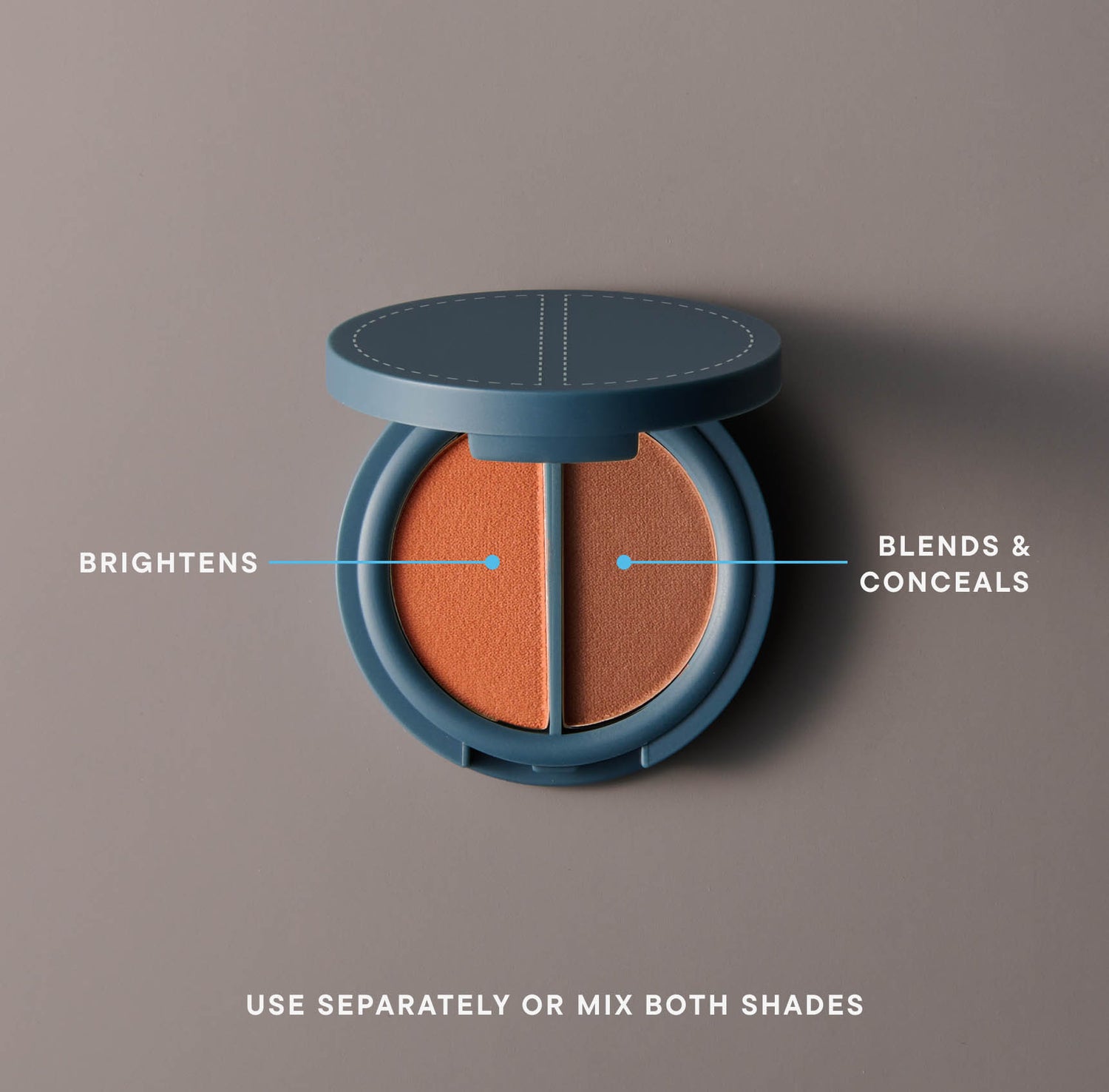 A round, teal-colored compact of brown pressed cosmetic powder in two hues on a gray background. The powder on the left side is labeled &